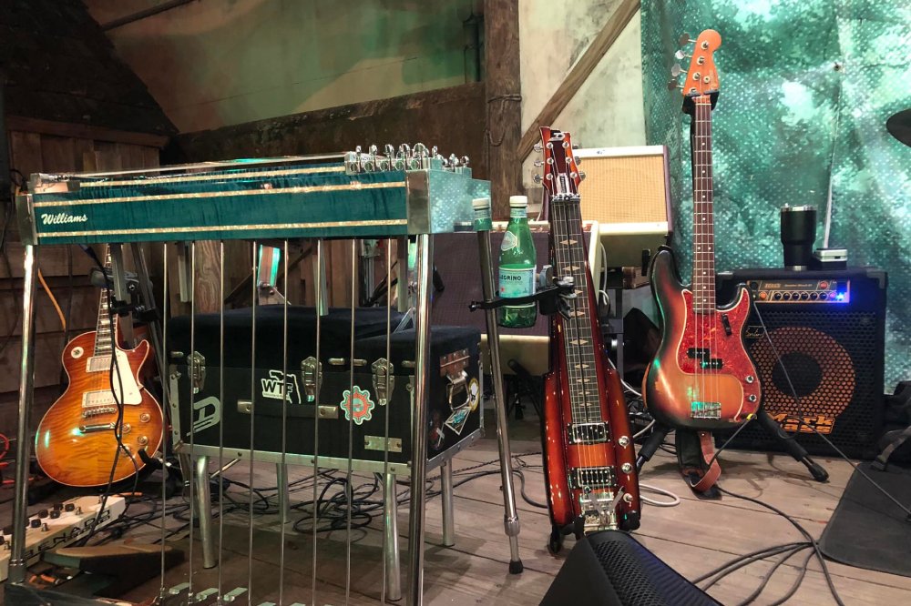 Music room with guitar and cymbals.